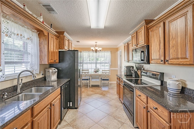 124 Jennifer Cir, Rincon, GA 31326 - kitchen with black appliances, a textured ceiling, a chandelier, brown cabinetry, and crown molding