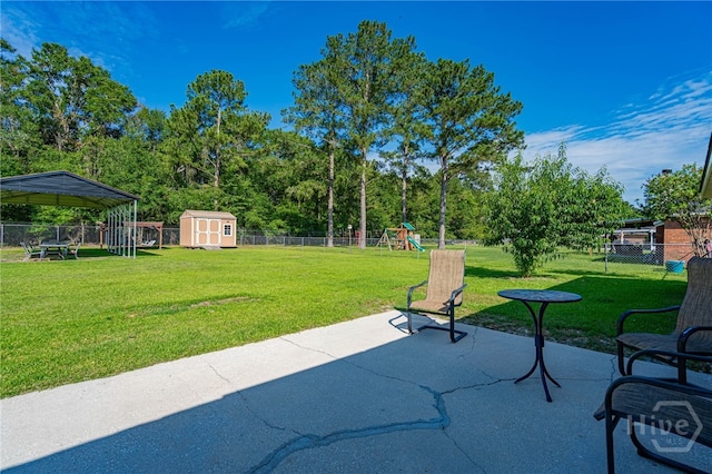 124 Jennifer Cir, Rincon, GA 31326 - fenced backyard featuring a playground, a patio, and a shed