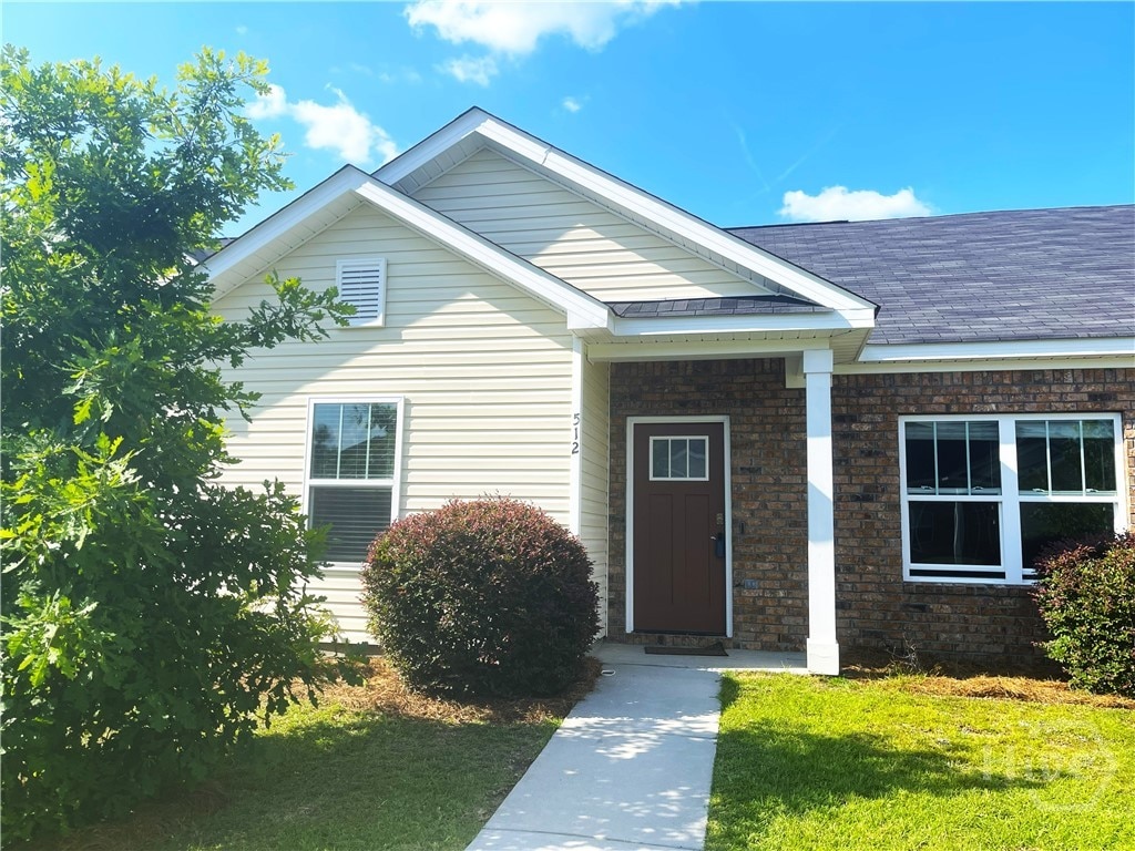 512 Potter Stone Sq, Pooler, GA 31322 - property entrance with roof with shingles and a lawn