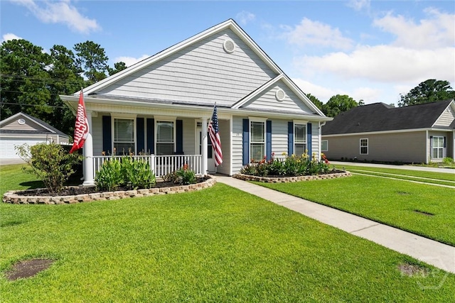 25 Savannah Ln, Richmond Hill, GA 31324 - view of front of home with a porch, a front lawn, and a garage