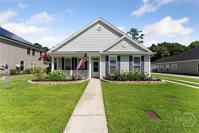 25 Savannah Ln, Richmond Hill, GA 31324 - view of front of house featuring a porch and a front yard