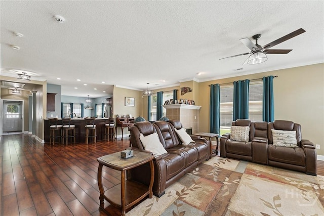 25 Savannah Ln, Richmond Hill, GA 31324 - living area with a ceiling fan, a textured ceiling, ornamental molding, and wood finished floors