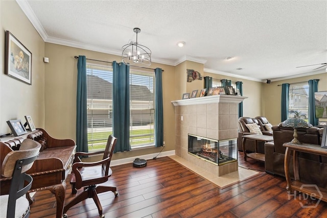 25 Savannah Ln, Richmond Hill, GA 31324 - home office with dark wood-style flooring, a textured ceiling, a chandelier, ornamental molding, and a fireplace