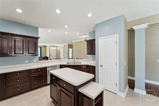 25 Savannah Ln, Richmond Hill, GA 31324 - kitchen featuring stainless steel dishwasher, light countertops, dark brown cabinetry, a kitchen island, and light tile patterned flooring