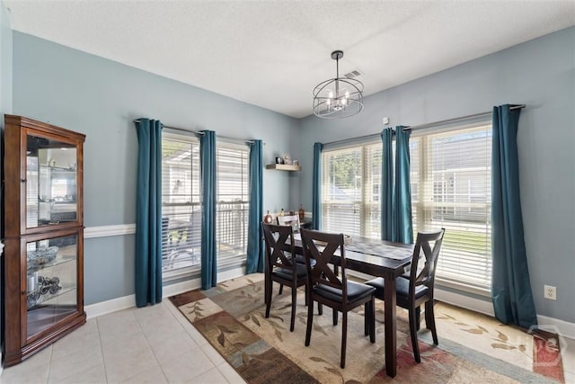 25 Savannah Ln, Richmond Hill, GA 31324 - dining room with a chandelier, plenty of natural light, light tile patterned floors, and a textured ceiling