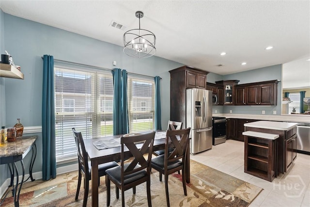 25 Savannah Ln, Richmond Hill, GA 31324 - dining room with a chandelier, recessed lighting, and light tile patterned floors