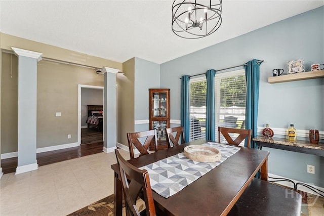 25 Savannah Ln, Richmond Hill, GA 31324 - dining space featuring decorative columns and a chandelier