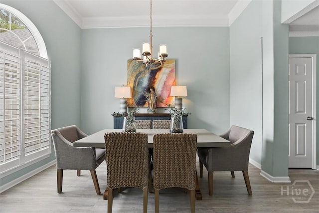 144 Summer Winds Dr, Savannah, GA 31410 - dining room featuring a chandelier, crown molding, and wood finished floors