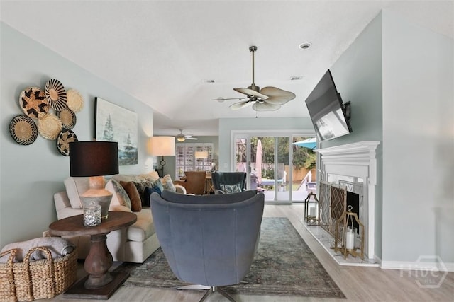 144 Summer Winds Dr, Savannah, GA 31410 - living area featuring a ceiling fan, wood finished floors, a premium fireplace, and lofted ceiling