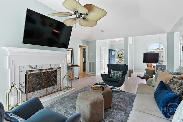 144 Summer Winds Dr, Savannah, GA 31410 - living area with vaulted ceiling, wood finished floors, ceiling fan, and a high end fireplace