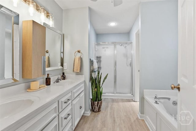 144 Summer Winds Dr, Savannah, GA 31410 - full bath featuring a shower stall, double vanity, a garden tub, wood finished floors, and a ceiling fan