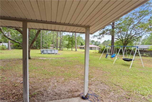 65 Fabian Ln, Hinesville, GA 31313 - view of yard featuring a playground