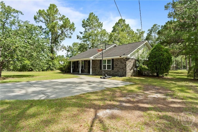 65 Fabian Ln, Hinesville, GA 31313 - back of house featuring a yard and brick siding