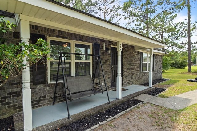 65 Fabian Ln, Hinesville, GA 31313 - entrance to property with brick siding and covered porch
