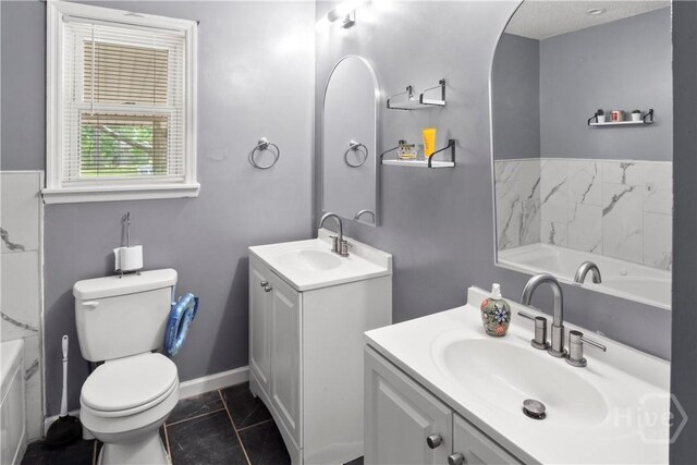 65 Fabian Ln, Hinesville, GA 31313 - full bath with two vanities, a tub to relax in, and tile patterned floors