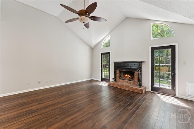 6 Emmet Ct, Savannah, GA 31419 - unfurnished living room featuring healthy amount of natural light, a fireplace, ceiling fan, wood finished floors, and high vaulted ceiling