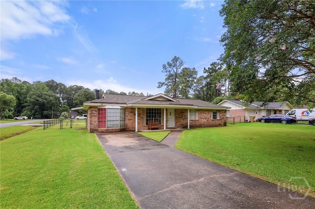 101 Greene Dr, Rincon, GA 31326 - ranch-style house featuring a porch, brick siding, and driveway