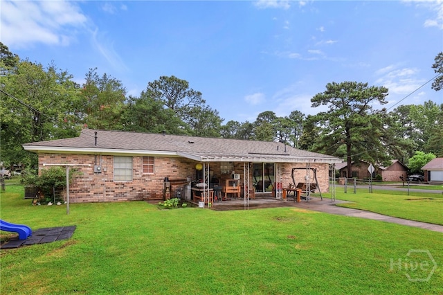 101 Greene Dr, Rincon, GA 31326 - rear view of house with a patio and brick siding