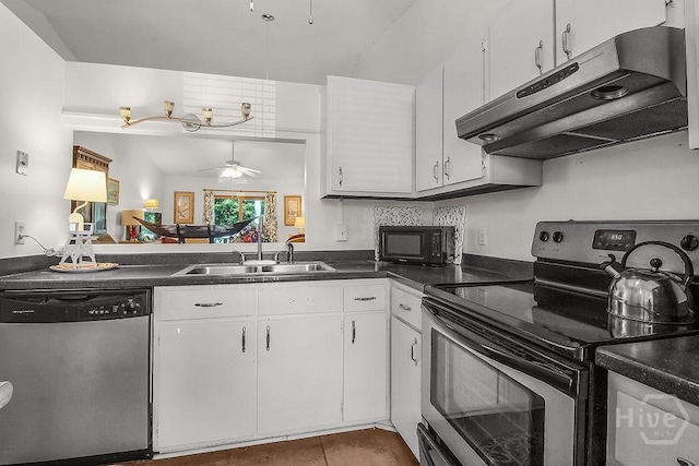 104 Shoals Dr Unit L8, Savannah, GA 31410 - kitchen with stainless steel appliances, under cabinet range hood, ceiling fan, dark countertops, and white cabinets