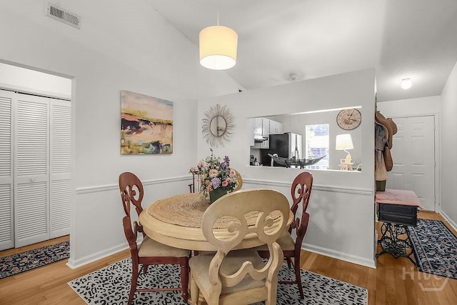 104 Shoals Dr Unit L8, Savannah, GA 31410 - dining space with wood finished floors and lofted ceiling