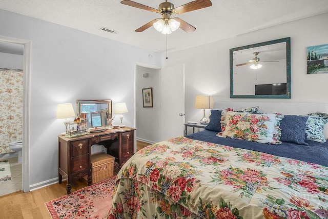 104 Shoals Dr Unit L8, Savannah, GA 31410 - bedroom with wood finished floors, ceiling fan, and connected bathroom