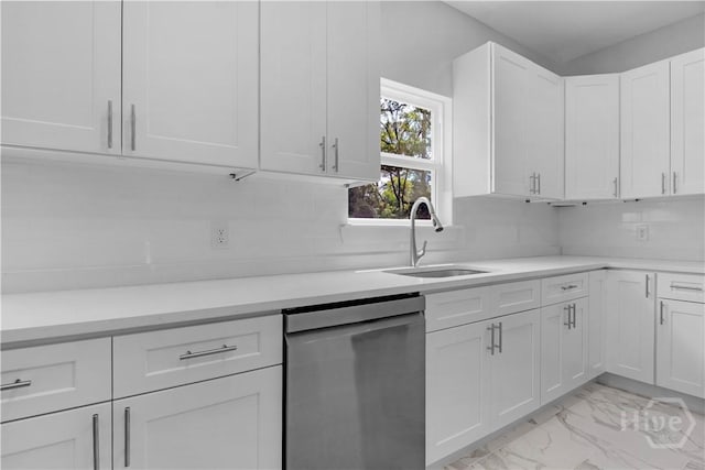 222 N Skinner Ave, Pooler, GA 31322 - kitchen with stainless steel dishwasher, light marble finish floors, white cabinetry, light countertops, and backsplash