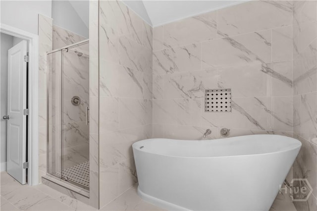 222 N Skinner Ave, Pooler, GA 31322 - bathroom featuring marble look tiles, a freestanding bath, and a marble finish shower