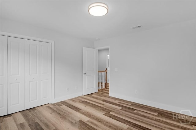 222 N Skinner Ave, Pooler, GA 31322 - unfurnished bedroom featuring wood finished floors and a closet