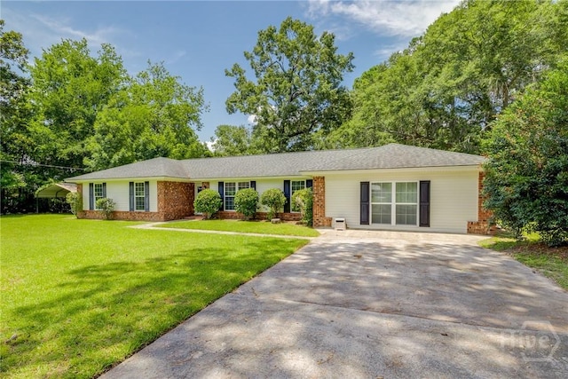 322 Suncrest Blvd, Savannah, GA 31410 - view of front of house featuring driveway, brick siding, and a front lawn