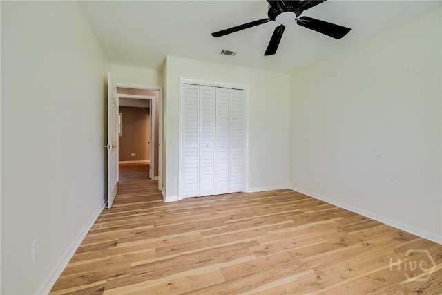 322 Suncrest Blvd, Savannah, GA 31410 - unfurnished bedroom with light wood-style flooring, a closet, and a ceiling fan