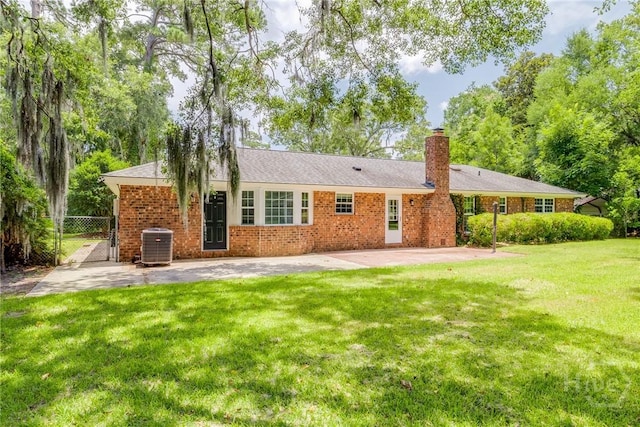 322 Suncrest Blvd, Savannah, GA 31410 - back of property featuring a chimney, a gate, a patio, and brick siding