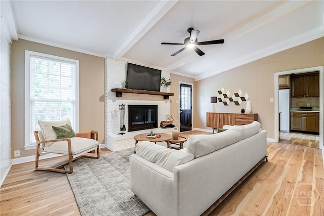 322 Suncrest Blvd, Savannah, GA 31410 - living area with light wood-style flooring, a brick fireplace, and a ceiling fan