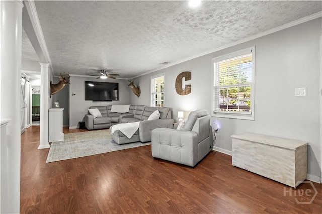 1001 Debbie St, Savannah, GA 31410 - living room with decorative columns, ceiling fan, dark wood finished floors, ornamental molding, and a textured ceiling