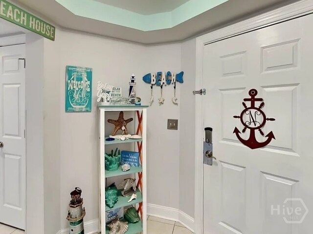 1415 Butler Ave Unit 1, Tybee Island, GA 31328 - foyer with light tile patterned floors and baseboards