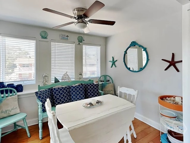 1415 Butler Ave Unit 1, Tybee Island, GA 31328 - dining space with healthy amount of natural light, light wood-style floors, and ceiling fan