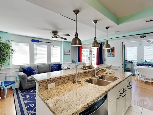 1415 Butler Ave Unit 1, Tybee Island, GA 31328 - kitchen with dishwasher, open floor plan, healthy amount of natural light, and a center island with sink