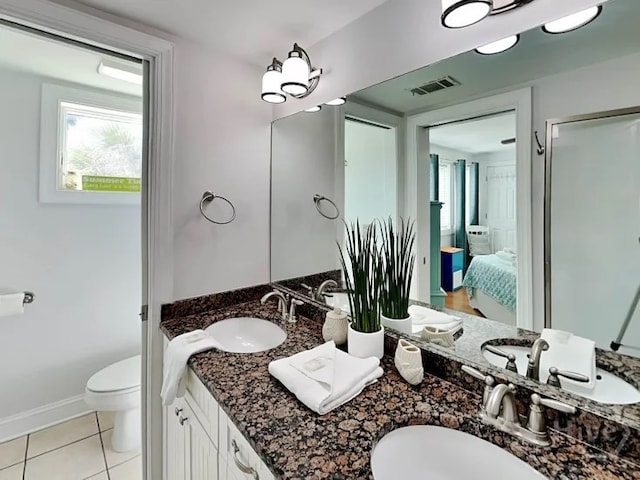 1415 Butler Ave Unit 1, Tybee Island, GA 31328 - bathroom with double vanity, tile patterned flooring, connected bathroom, and healthy amount of natural light