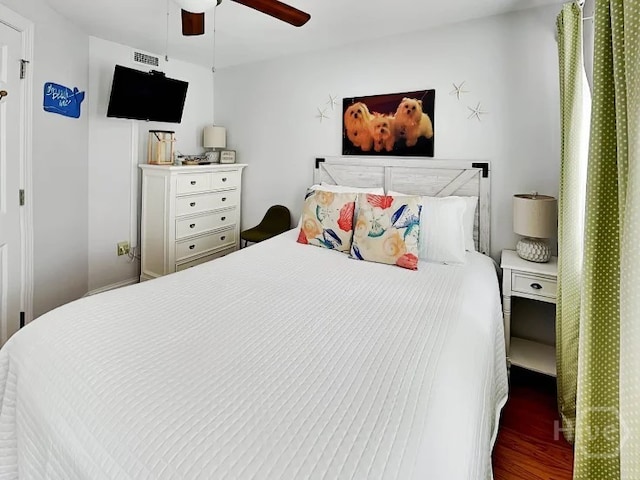 1415 Butler Ave Unit 1, Tybee Island, GA 31328 - bedroom with wood finished floors and a ceiling fan