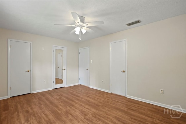 13609 Rockingham Ct, Savannah, GA 31419 - unfurnished bedroom with wood finished floors and ceiling fan