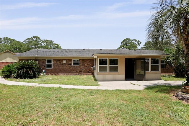 13609 Rockingham Ct, Savannah, GA 31419 - rear view of property featuring a lawn, a patio, and brick siding