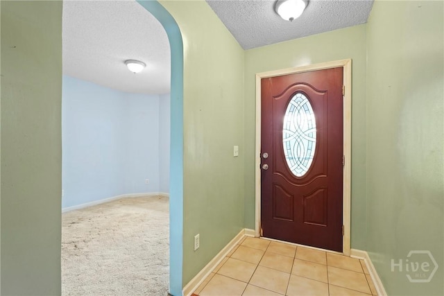 11 Gilliam Ave, Savannah, GA 31406 - foyer featuring a textured ceiling, arched walkways, and tile patterned flooring