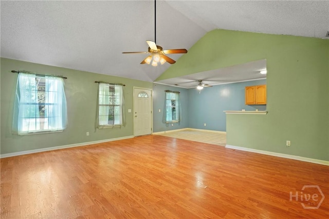 11 Gilliam Ave, Savannah, GA 31406 - unfurnished living room featuring ceiling fan, lofted ceiling, and light wood-type flooring