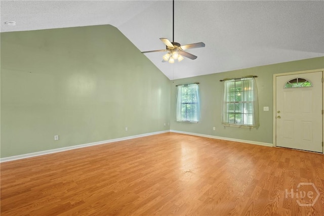 11 Gilliam Ave, Savannah, GA 31406 - unfurnished living room featuring ceiling fan, light wood-style floors, and high vaulted ceiling
