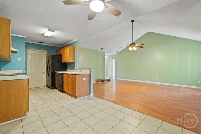 11 Gilliam Ave, Savannah, GA 31406 - kitchen with a ceiling fan, black appliances, light countertops, a textured ceiling, and light tile patterned floors