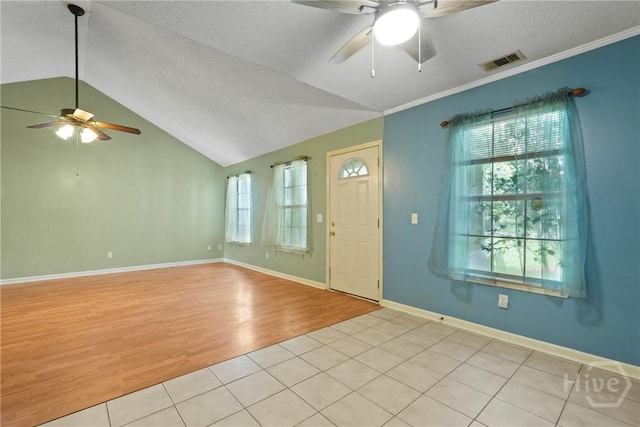 11 Gilliam Ave, Savannah, GA 31406 - foyer entrance featuring ceiling fan, lofted ceiling, light wood finished floors, a textured ceiling, and crown molding