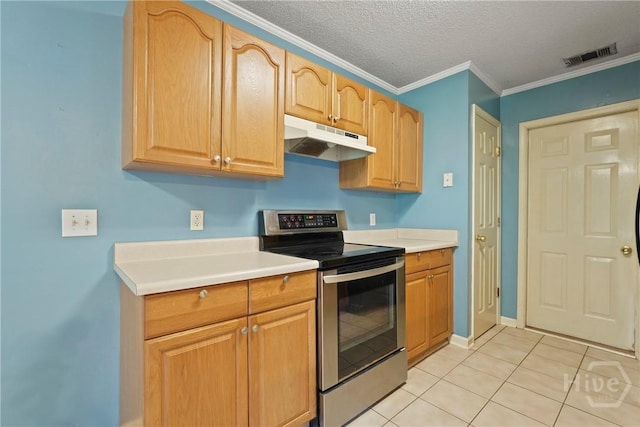 11 Gilliam Ave, Savannah, GA 31406 - kitchen featuring stainless steel range with electric stovetop, under cabinet range hood, light countertops, light tile patterned floors, and crown molding