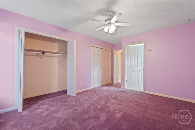 11 Gilliam Ave, Savannah, GA 31406 - unfurnished bedroom featuring two closets, carpet flooring, a textured ceiling, and ceiling fan