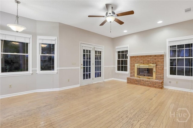 123 Companion Way, Savannah, GA 31419 - unfurnished living room featuring light wood-type flooring, a ceiling fan, a brick fireplace, and recessed lighting