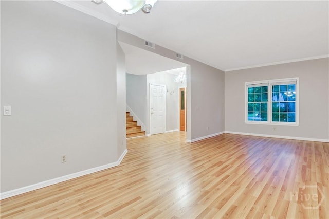 123 Companion Way, Savannah, GA 31419 - unfurnished room featuring a chandelier, stairway, ornamental molding, and light wood-style flooring