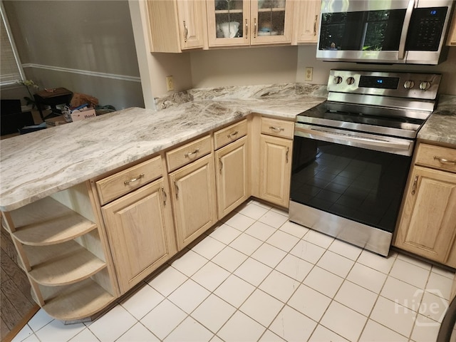 123 Companion Way, Savannah, GA 31419 - kitchen with appliances with stainless steel finishes, open shelves, light brown cabinetry, light tile patterned flooring, and glass insert cabinets
